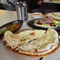 Roti prata with chicken curry and vegetables