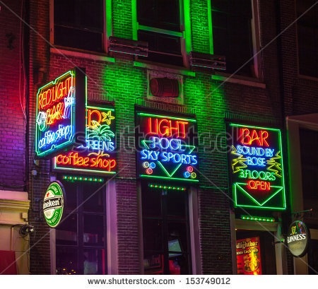Night image of colourful coffee shop signs in the Red Light District of Amsterdam (Picture courtesy of shutterstock.com).
