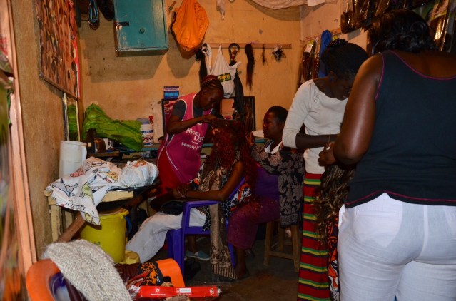 Getting our hair made at Kenyatta Market, Ngummo Estate in Nairobi, Kenya.