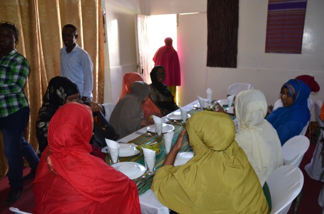 At the table with friendly Somali ladies waiting for the meal