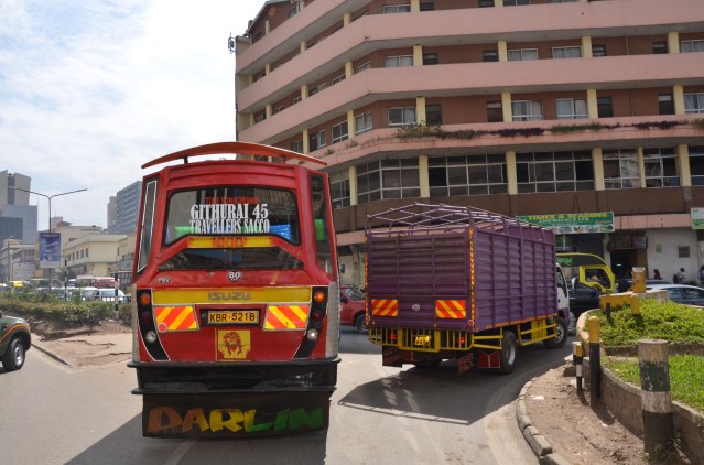 A matatu tries to wange its way out of traffic.