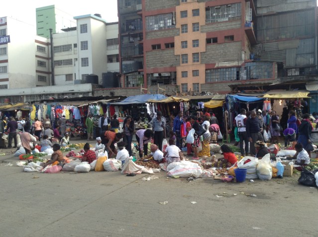 Fruit and vegetable sellers at bus station, Nairobi.